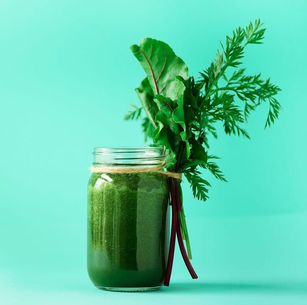 Healthy green juice and its fresh ingredients